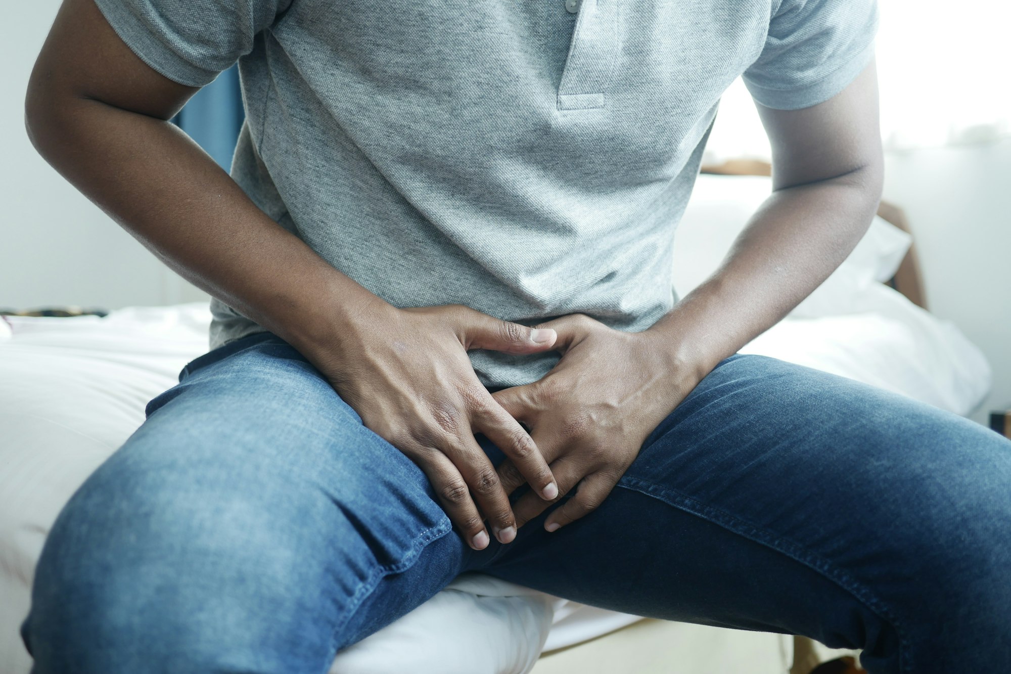 the concept of prostate and bladder problem, crotch pain of a young person