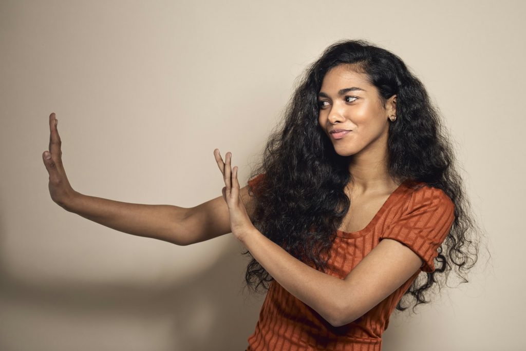 Spanish woman gesturing stop sign